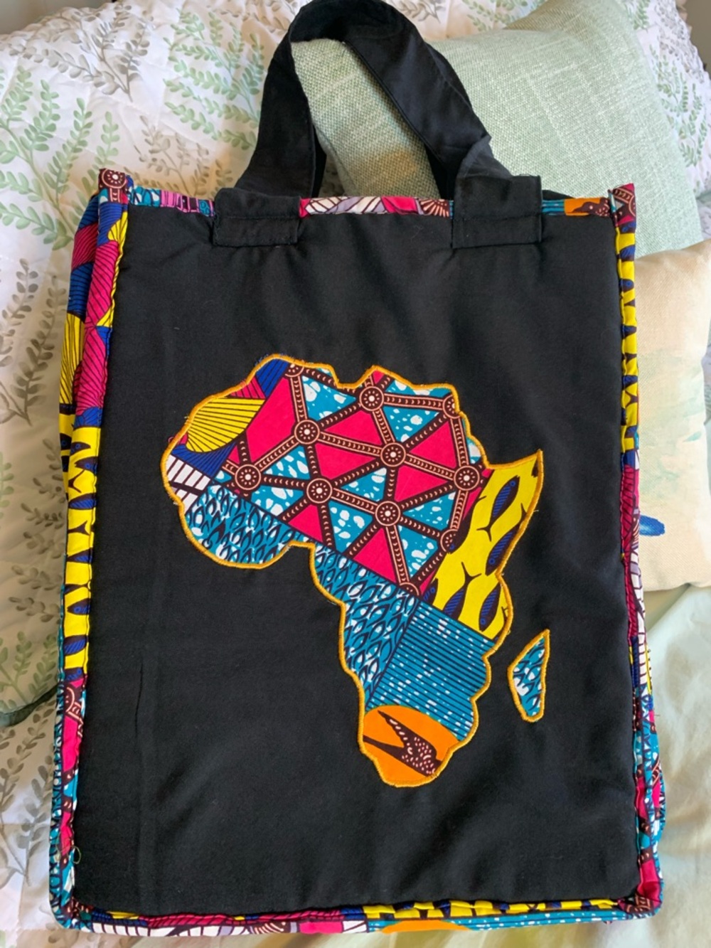 Black and multicolor tote bag with Africa appliqué